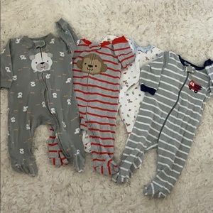 Four 3-6 month footed onesies